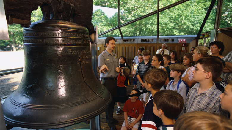 Children listening to a guide at the Liberty Bell
