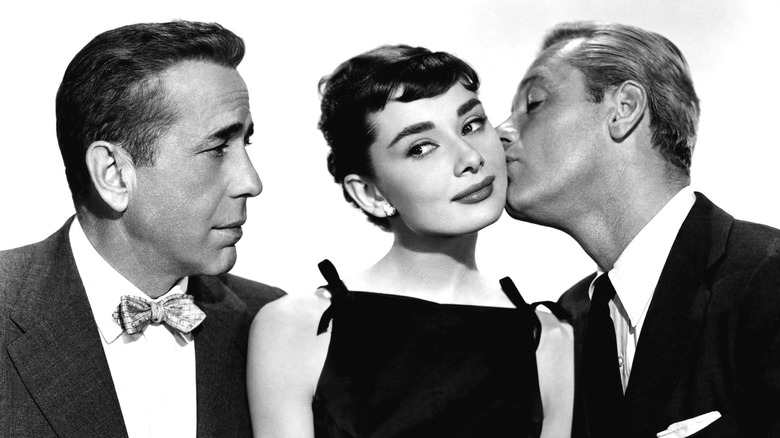 Humphrey Bogart looking at Audrey Hepburn in "Sabrina"