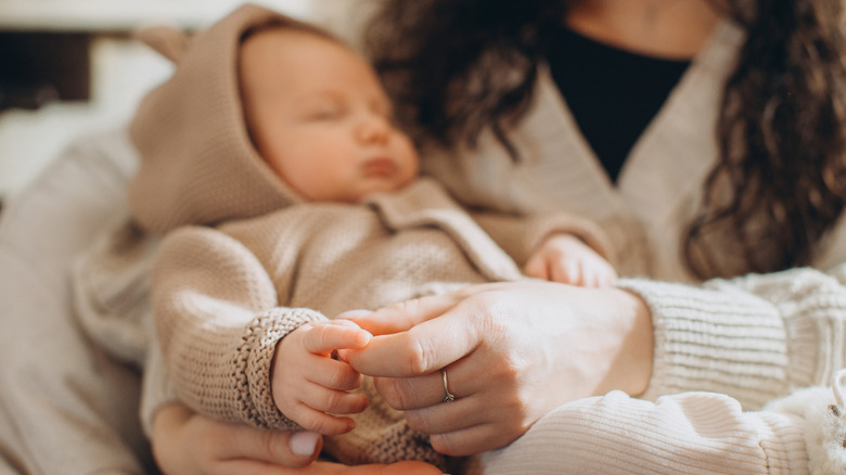 Mom holding a baby