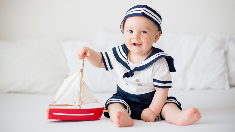 little boy with a sailboat
