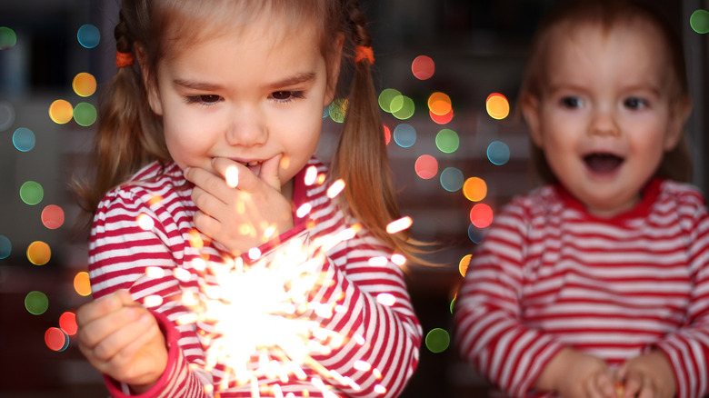girl holding a sparkler