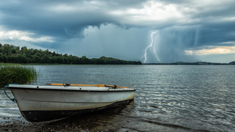 daytime lightning storm over a lake
