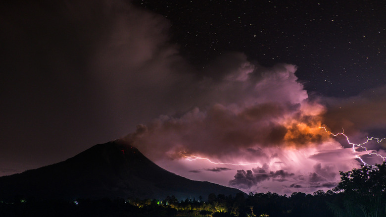 lightning over a volcano in indonesia