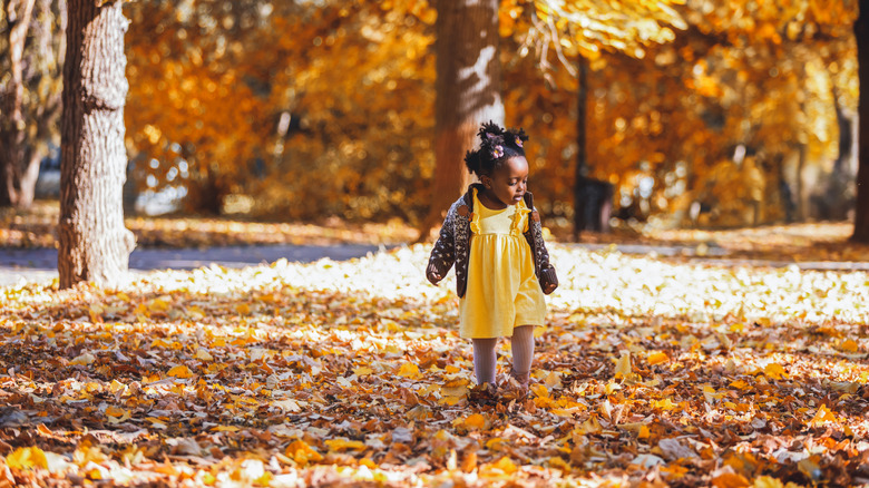 little girl in a golden yellow dress