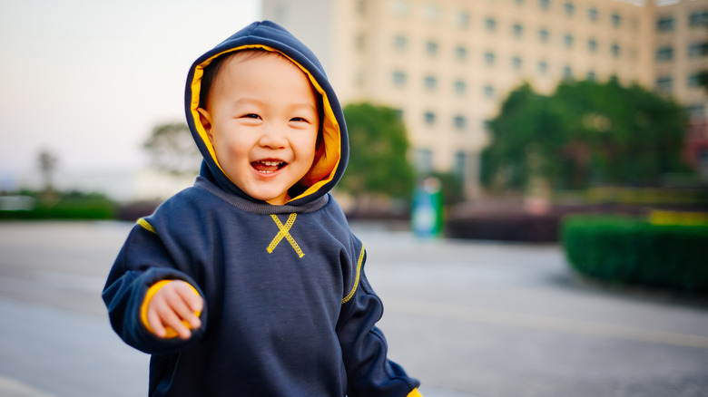 little boy in a navy blue hoodie