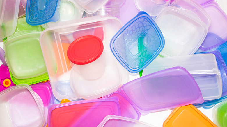 Lots of empty plastic containers fill the image in disarray