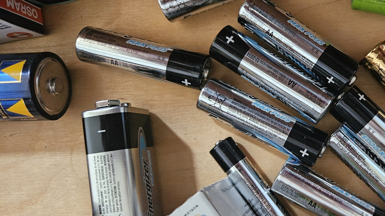 A collection of household batteries on a counter