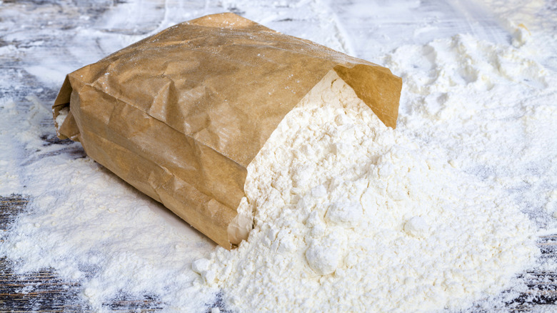 A bag of flour spilled on a counter