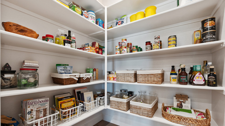 The corner of a large, organized kitchen pantry