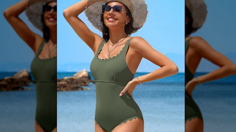 Woman on beach in green swimsuit