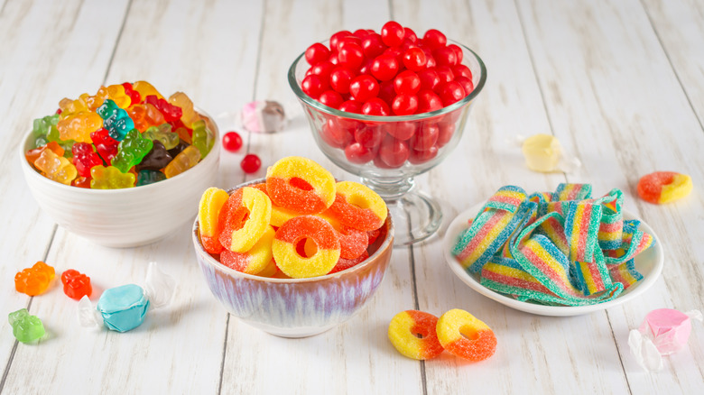 Various colored candies in bowls