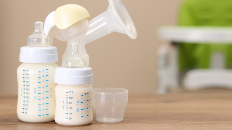 close-up of expressed breastmilk in storage bottles