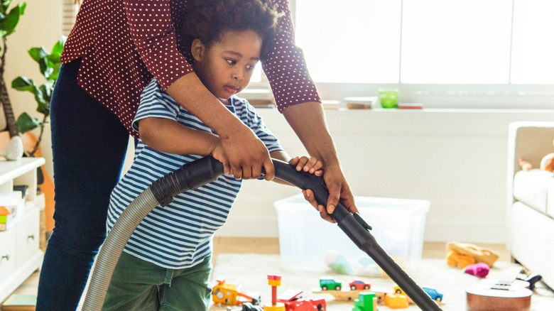 parent and child cleaning together
