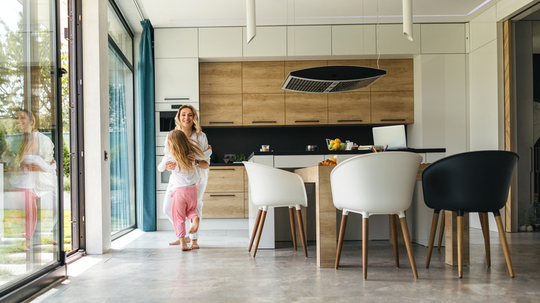 woman and daughter in kitchen with vinyl flooring