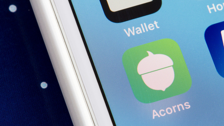 Close up of a the Acorns Investing app icon on a phone screen
