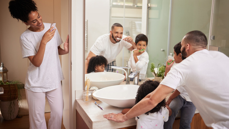 family shares a small bathroom at bedtime