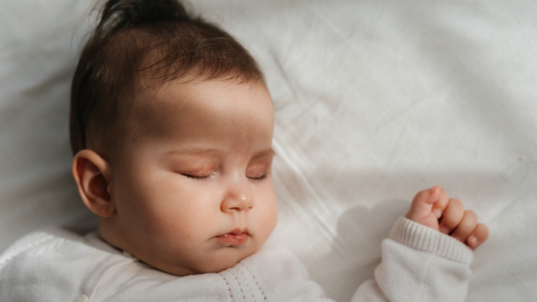 Baby sleeping in bed