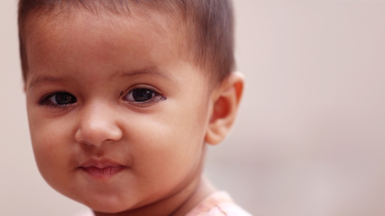 Close up of a baby girl looking into the camera