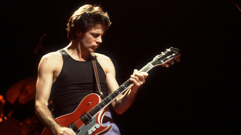 Rick Springfield playing guitar