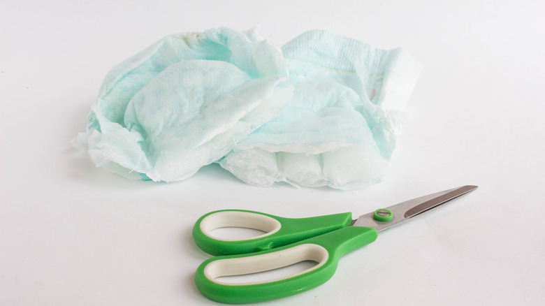 Scissors next to diapers