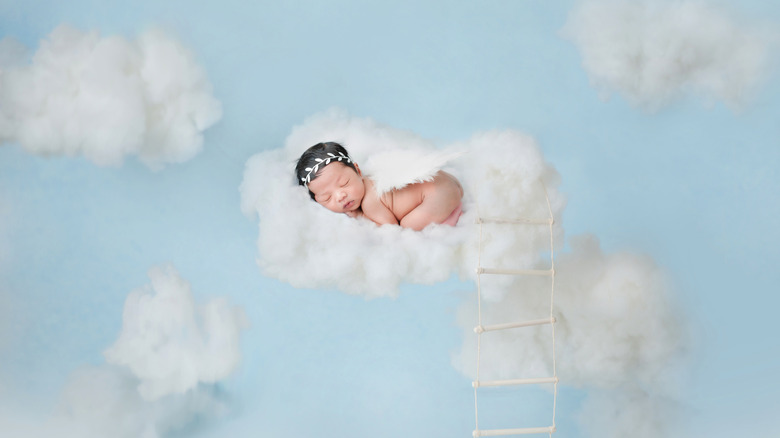 Baby sleeping in the clouds