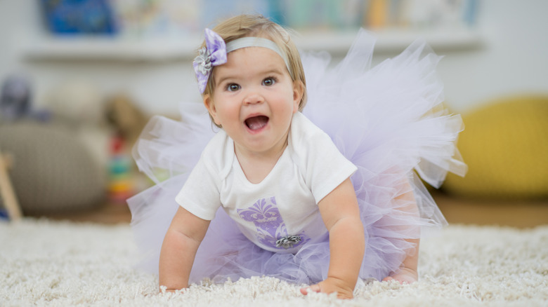 Baby in a purple tutu and headband