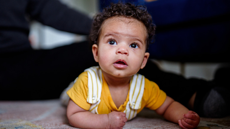 Baby on his stomach looking up