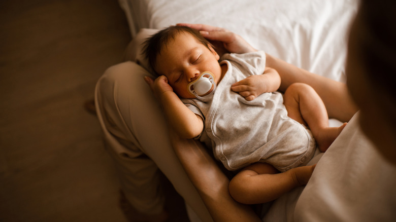 Mom holding a baby in her lap