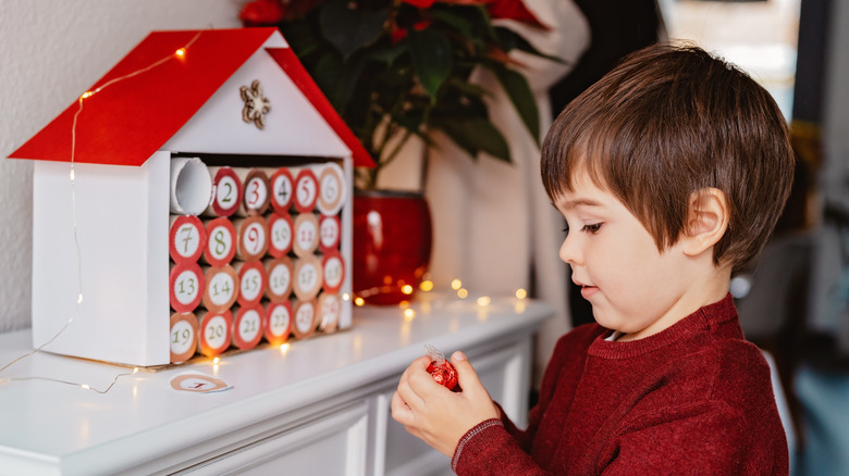 Little boy examining an Advent calendar