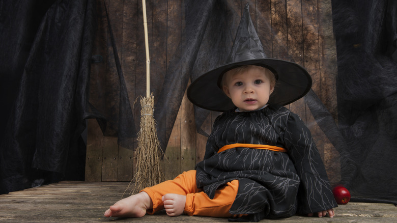toddler girl in witch costume