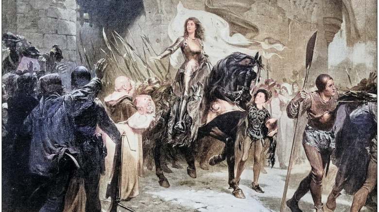 Painting depicting Joan of Arc riding a horse with people on both sides, many reaching for her