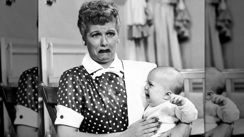 Lucy holding baby Ricky in an episode of I Love Lucy
