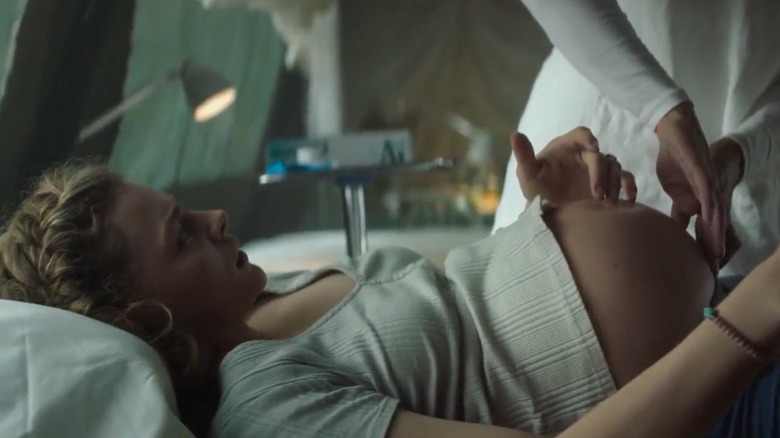 A scene from the 2021 movie Mother/Android in which the pregnant main character visits a military medical tent