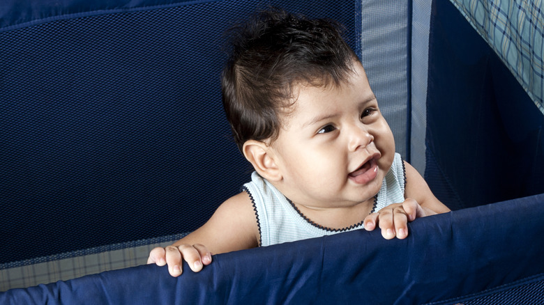 Baby in portable crib