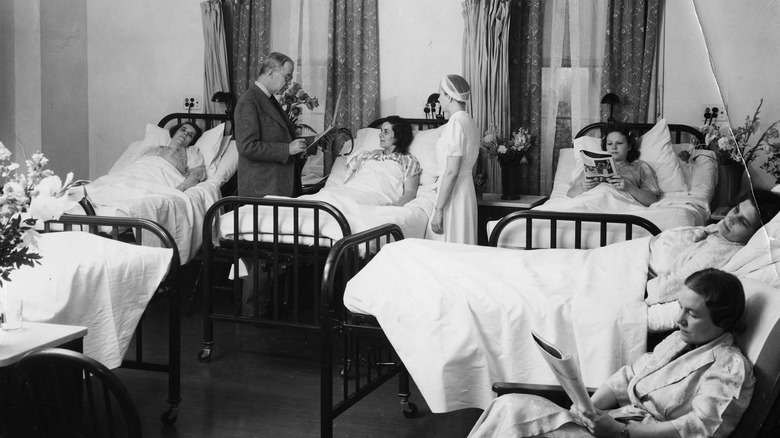 women resting in bed in a 1942 hospital ward