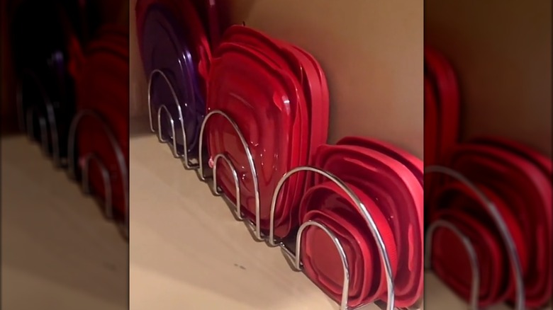 Stacks of Tupperware lids sorted in napkin holders
