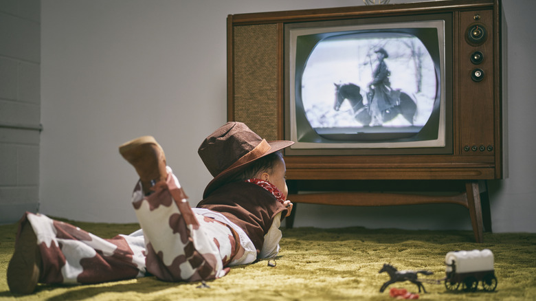 Child from the 1960s watching TV