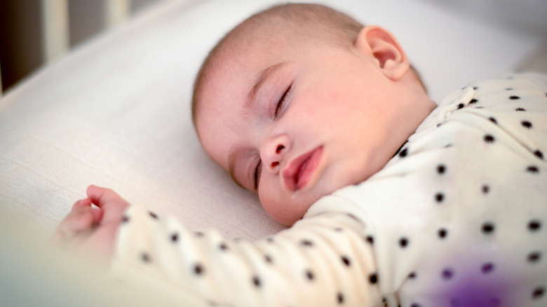 baby sleeping in a crib