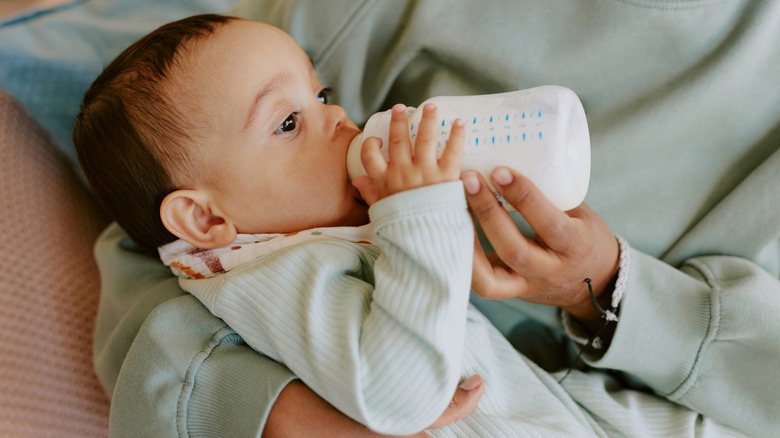 baby drinking a bottle