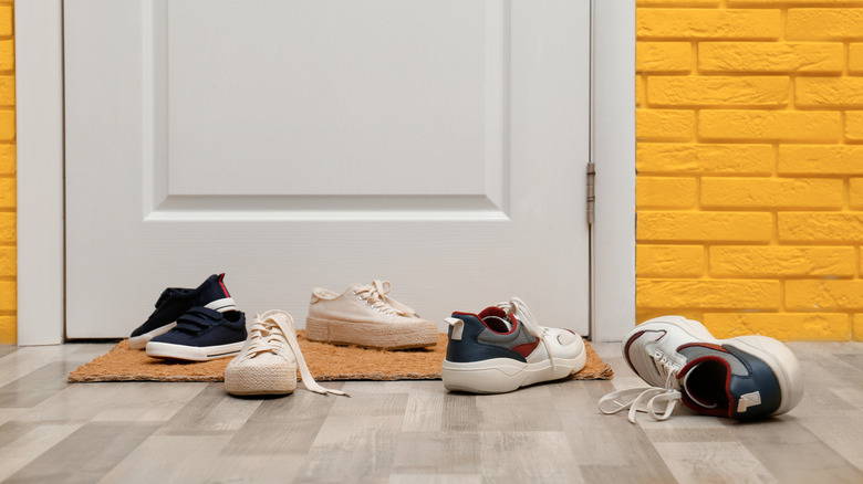 shoes near mat in hallway