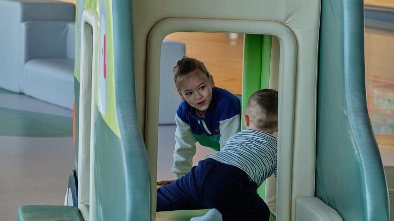 Kids playing in airport play space