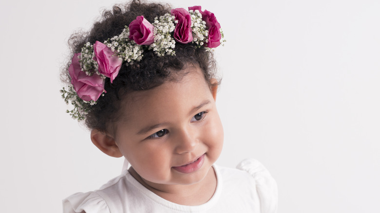 little girl with rosebud flower crown