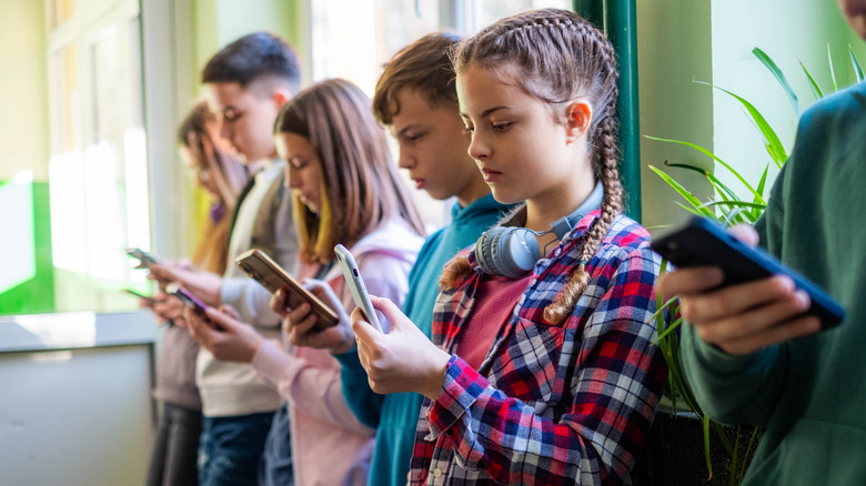 Line of kids on their phones
