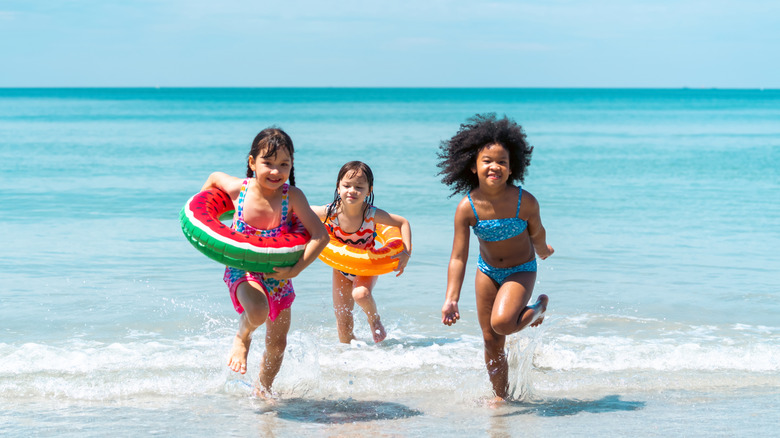 Children running on the beach
