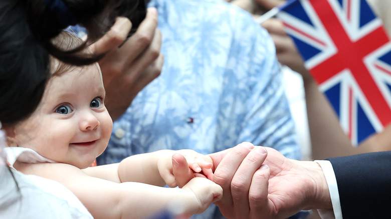 Baby in a crowd of royal supporters