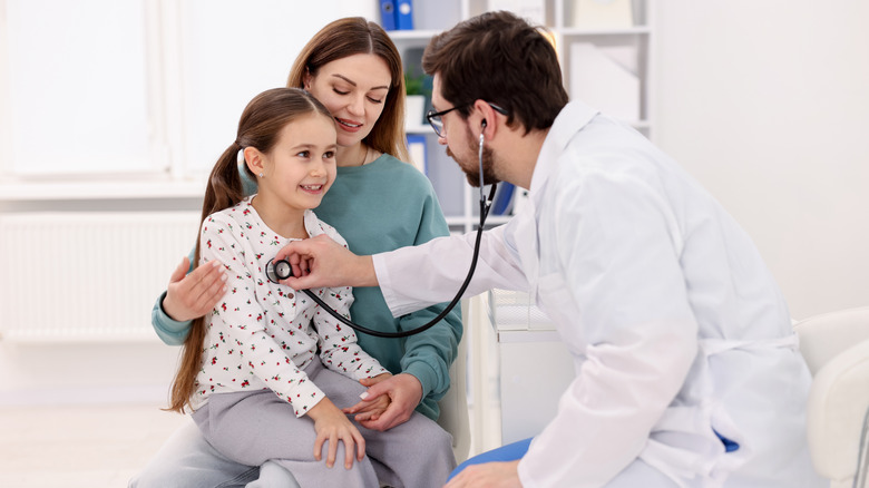 Doctor, mother, and daughter at the pediatrician's office