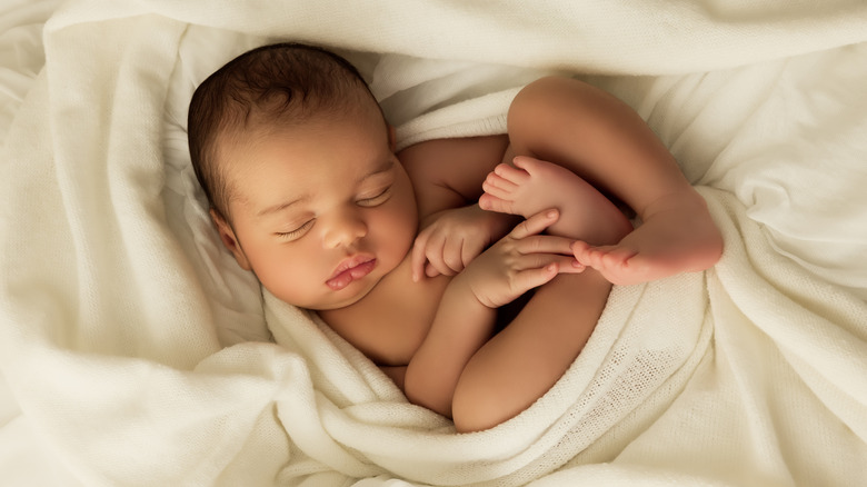 sleeping baby boy in blankets