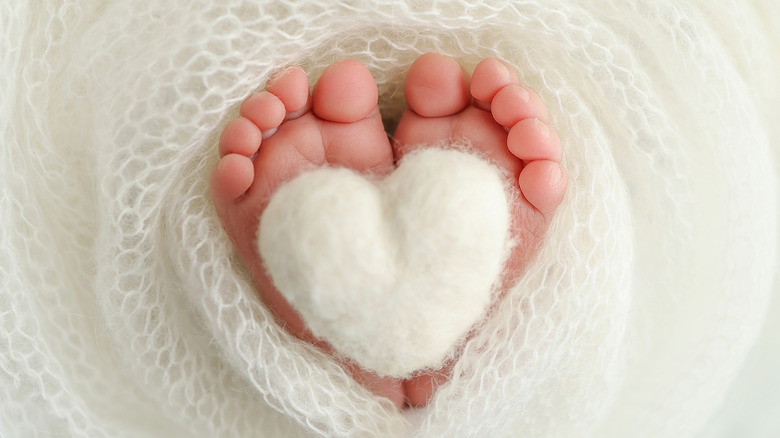 baby feet with a soft heart motif