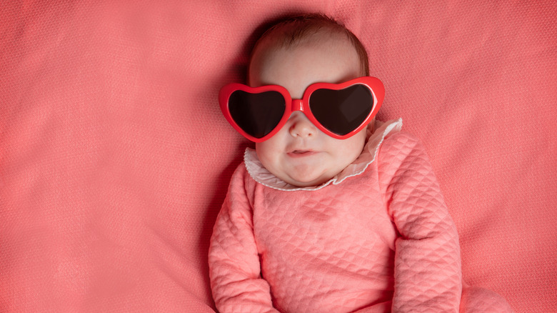 baby girl wearing heart-shaped sunglasses