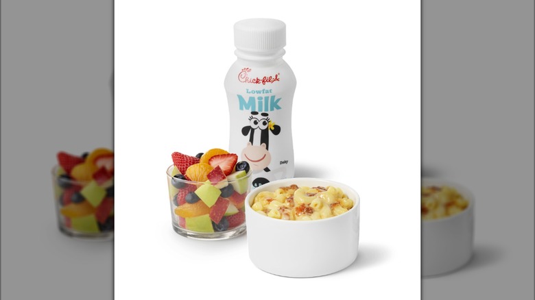 The Chick-Fil-A Mac & Cheese Kid's Meal with a cup of mac and cheese, a fruit cup, and a bottle of lowfat milk